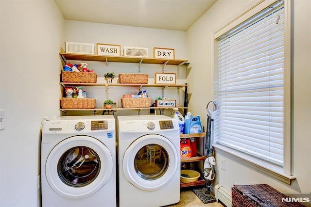 clothes washing area featuring independent washer and dryer and a baseboard radiator