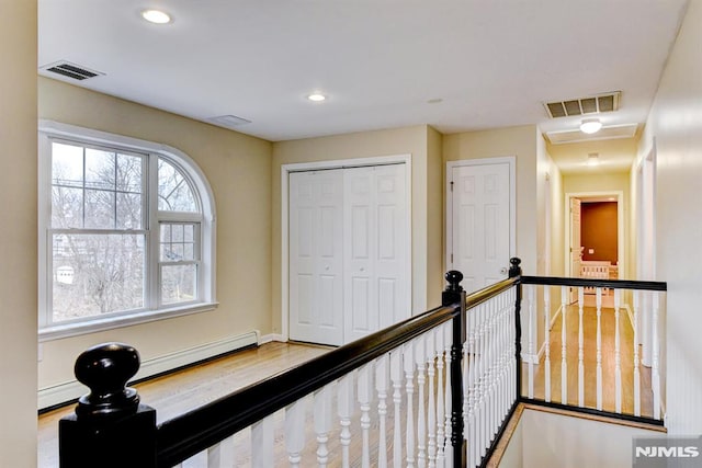 corridor featuring wood-type flooring