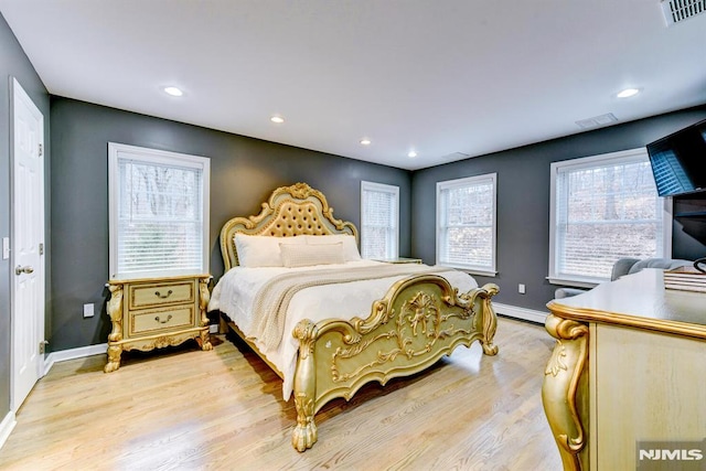 bedroom featuring light hardwood / wood-style floors