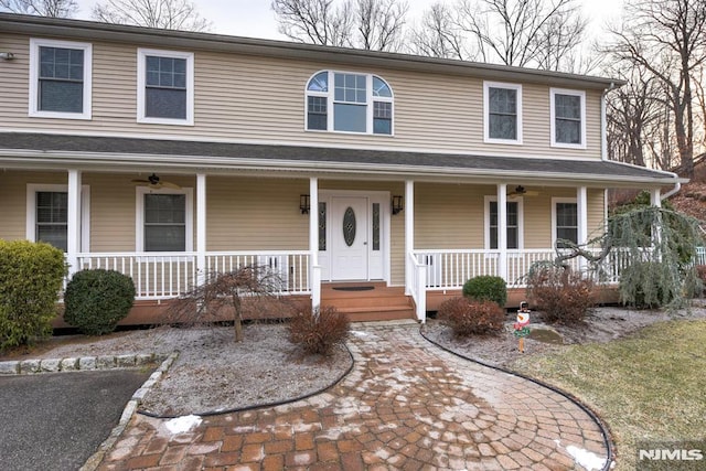 view of front of house featuring ceiling fan and covered porch