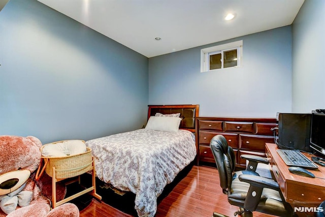 bedroom featuring hardwood / wood-style flooring