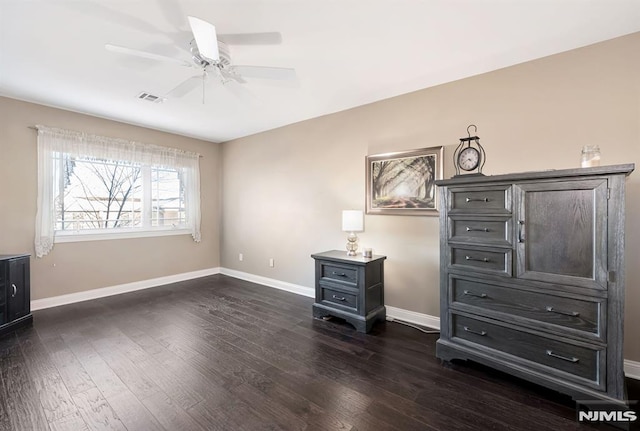 interior space featuring ceiling fan and dark hardwood / wood-style floors