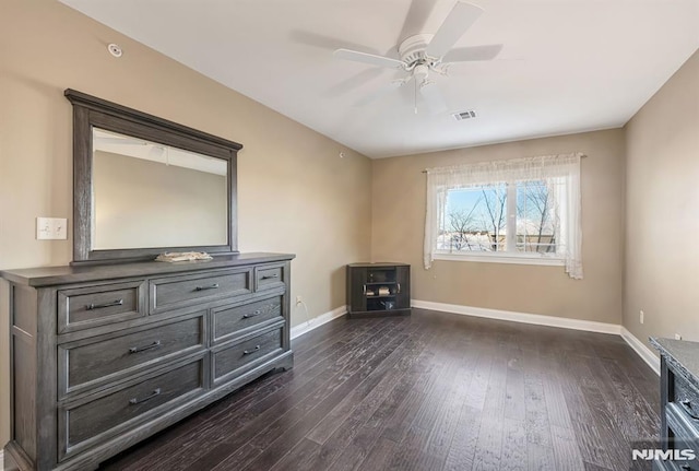 interior space featuring ceiling fan and dark wood-type flooring