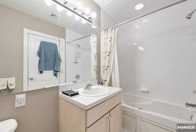 bathroom with vanity and shower / tub combo with curtain