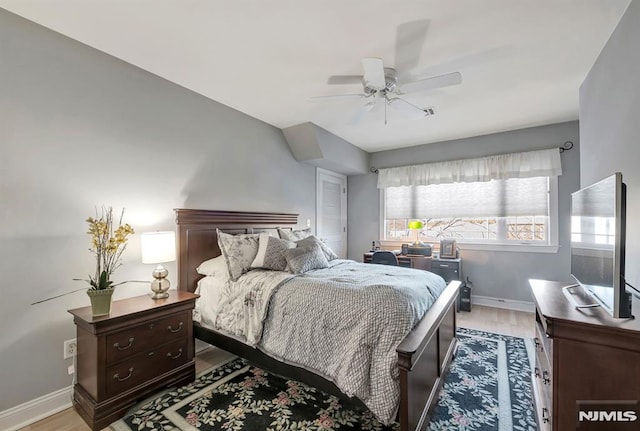 bedroom with ceiling fan and light hardwood / wood-style flooring