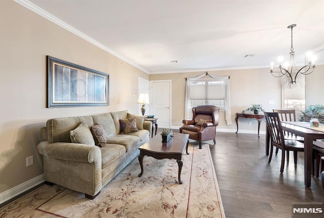 living room featuring a chandelier, ornamental molding, and hardwood / wood-style flooring