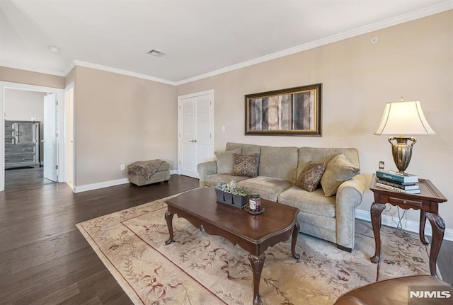 living room featuring dark hardwood / wood-style floors and crown molding