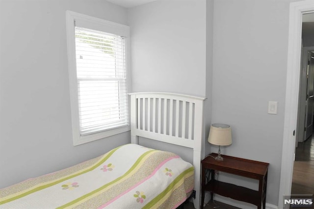 bedroom featuring multiple windows