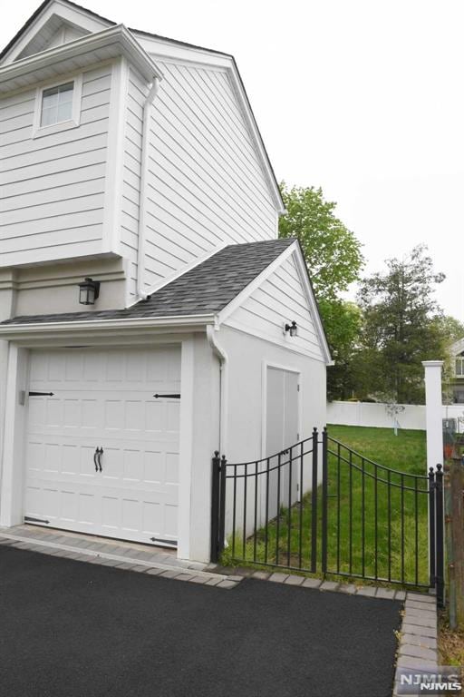 garage featuring a yard