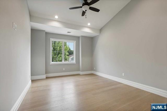 spare room with light hardwood / wood-style floors and ceiling fan