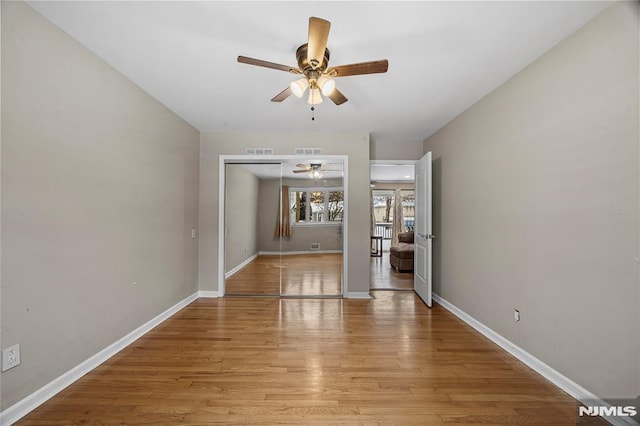 unfurnished dining area with ceiling fan and light hardwood / wood-style floors