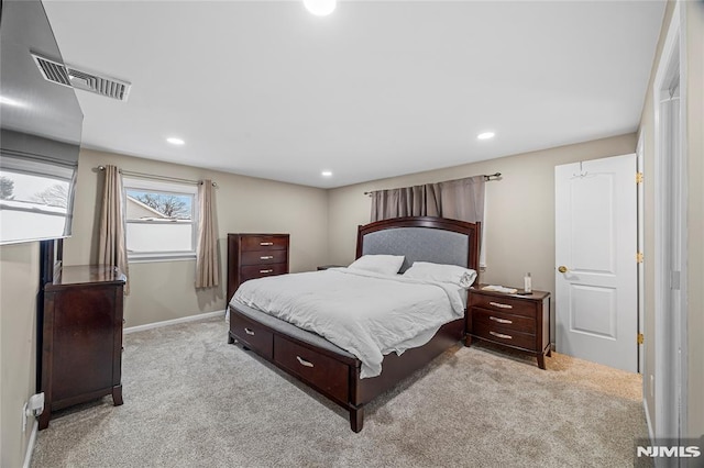 bedroom featuring light carpet