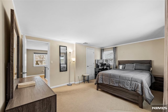 bedroom with light colored carpet and crown molding