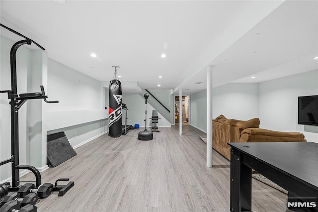 exercise area with light hardwood / wood-style floors