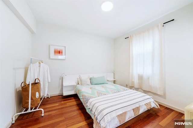 bedroom with wood-type flooring