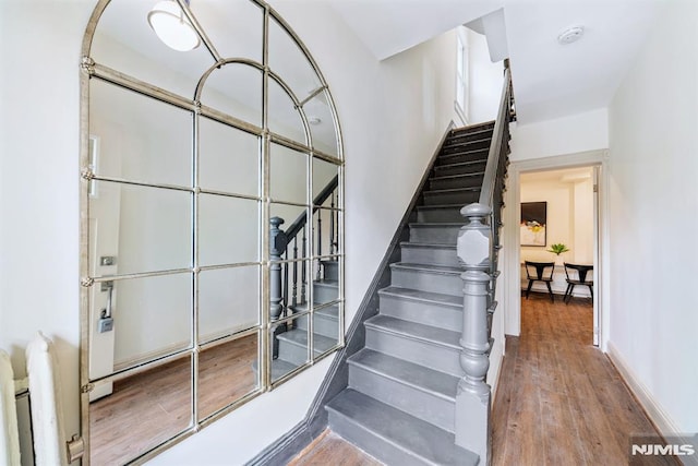 stairway featuring hardwood / wood-style flooring