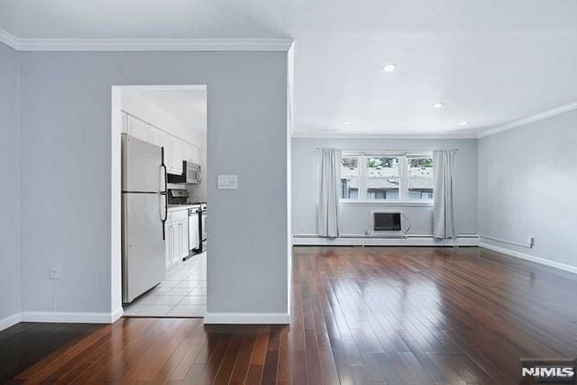 unfurnished living room with crown molding, hardwood / wood-style flooring, and a wall mounted air conditioner