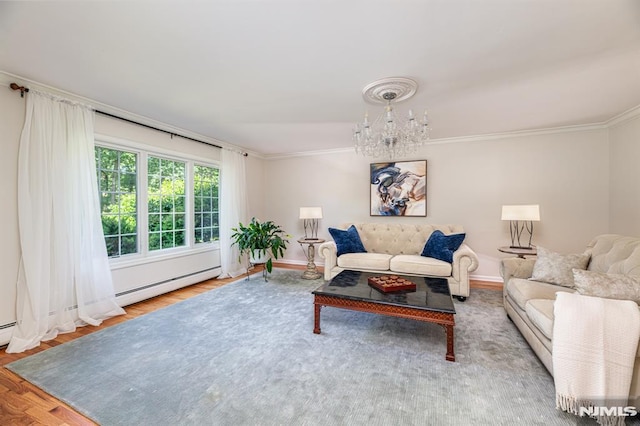 living room with wood-type flooring, a chandelier, and crown molding