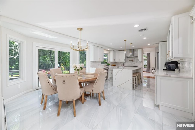 dining area featuring a chandelier