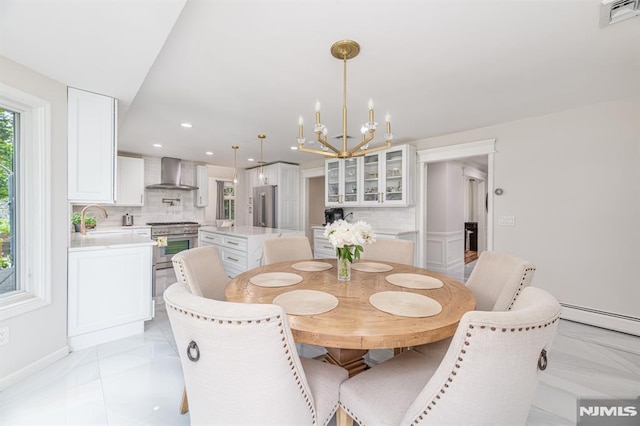 dining room featuring a baseboard radiator and an inviting chandelier