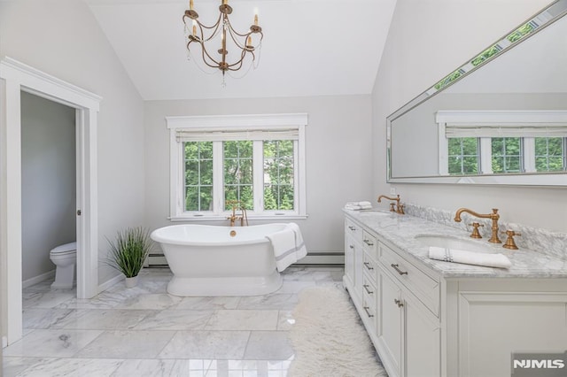 bathroom with vanity, vaulted ceiling, a baseboard heating unit, and a bathing tub