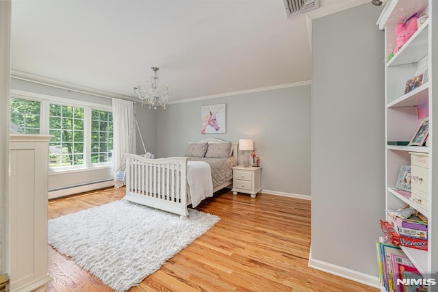 bedroom featuring baseboard heating, light hardwood / wood-style floors, a notable chandelier, and ornamental molding