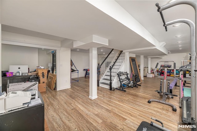 exercise room featuring light hardwood / wood-style flooring