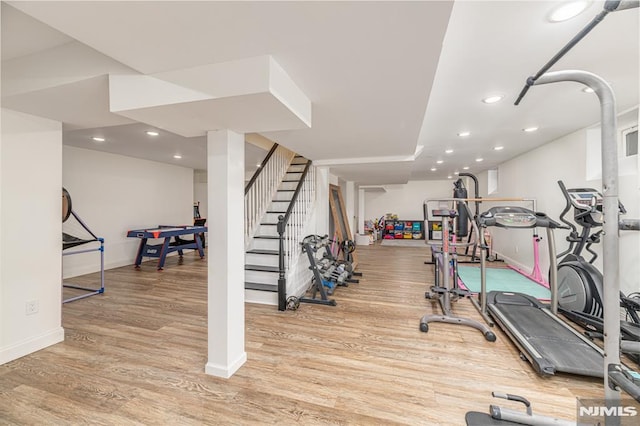 exercise area featuring light hardwood / wood-style floors