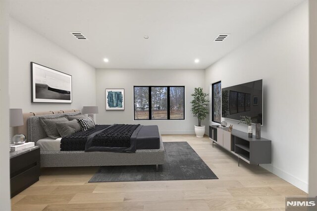 bedroom featuring light wood-type flooring