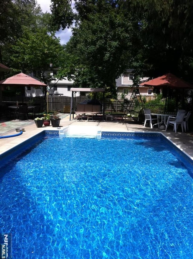 view of pool with a patio area