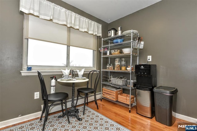 dining area with hardwood / wood-style flooring