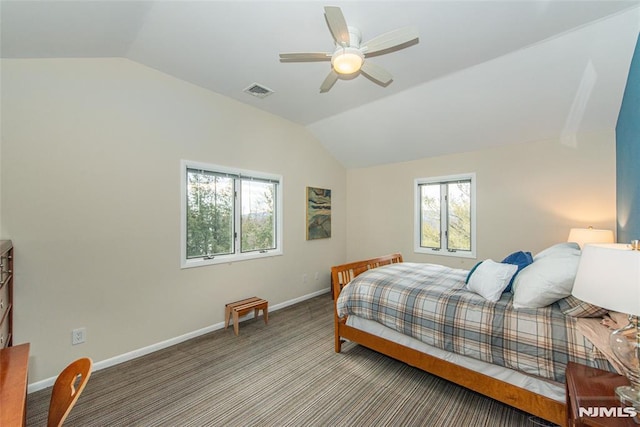 carpeted bedroom featuring lofted ceiling and ceiling fan