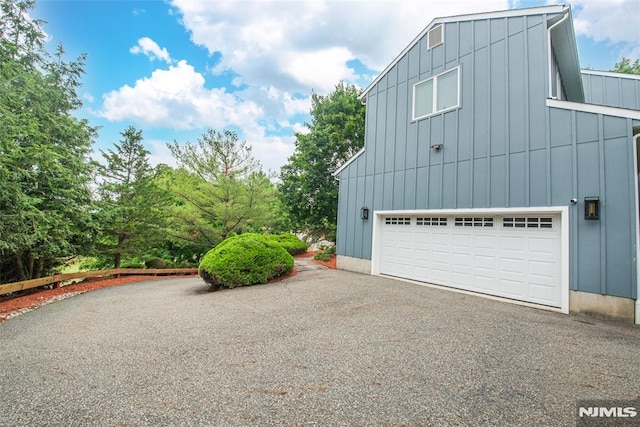 view of property exterior with a garage