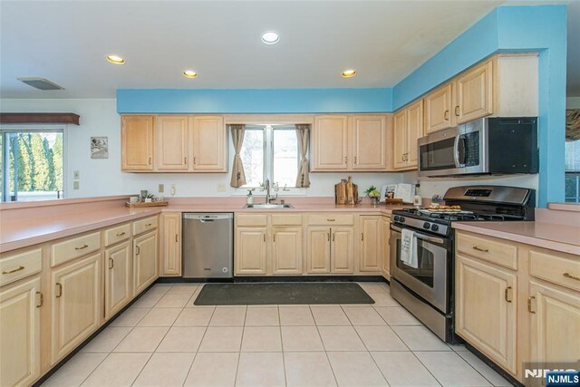 342 Mount Pleasant Ave, Rockaway Township, NJ 07801 - kitchen with sink, light tile patterned floors, light brown cabinets, and appliances with stainless steel finishes
