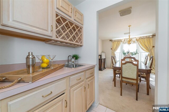 342 Mount Pleasant Ave, Rockaway Township, NJ 07801 - kitchen with an inviting chandelier, light colored carpet, sink, and hanging light fixtures