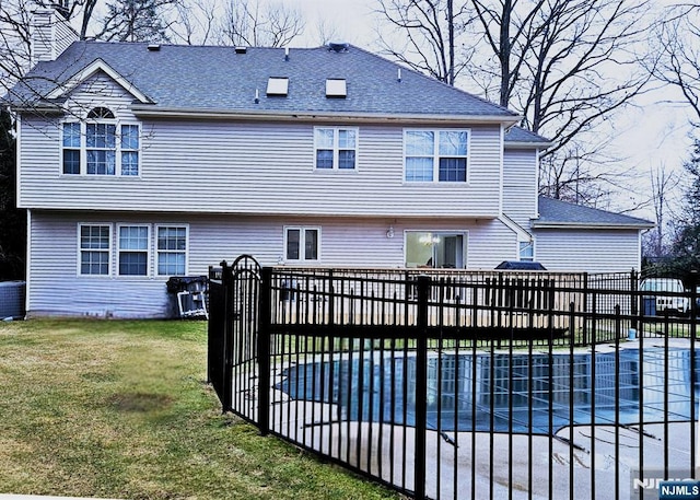 342 Mount Pleasant Ave, Rockaway Township, NJ 07801 - rear view of house featuring central AC, a swimming pool side deck, and a lawn