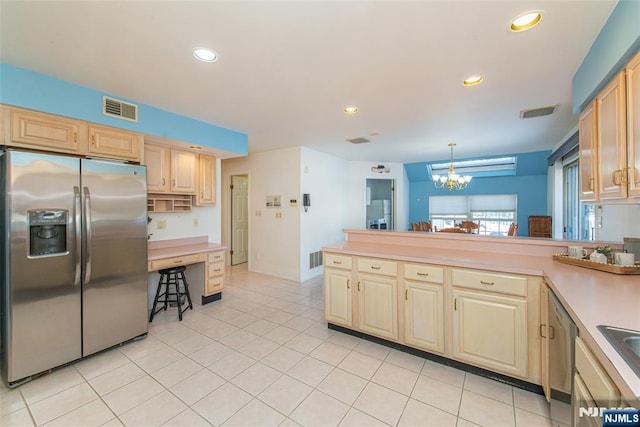 342 Mount Pleasant Ave, Rockaway Township, NJ 07801 - kitchen featuring stainless steel appliances, hanging light fixtures, light tile patterned floors, and a chandelier
