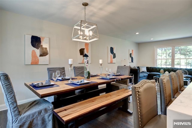 dining space with dark wood-type flooring