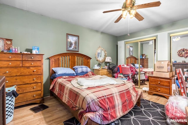 bedroom with a closet, ceiling fan, and light wood-type flooring