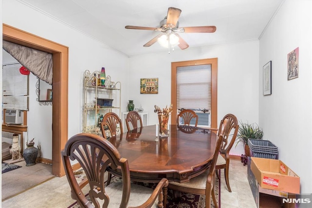 dining area with light tile patterned flooring, ceiling fan, and crown molding