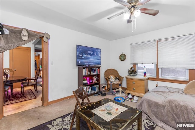 carpeted bedroom with ceiling fan