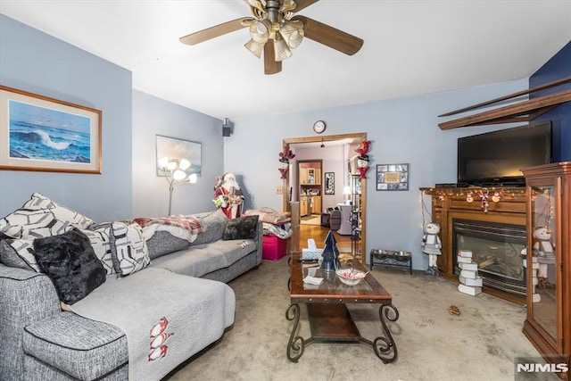 living room with carpet flooring and ceiling fan