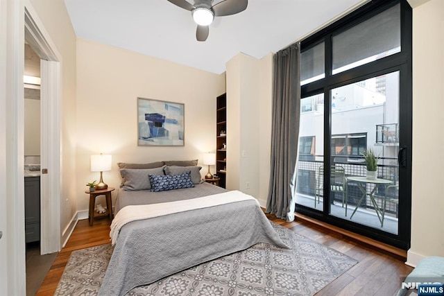 bedroom with baseboards, wood finished floors, a ceiling fan, and access to outside