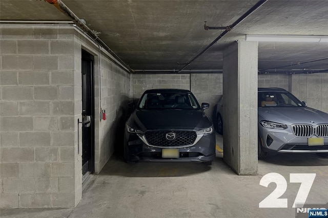 parking deck featuring concrete block wall