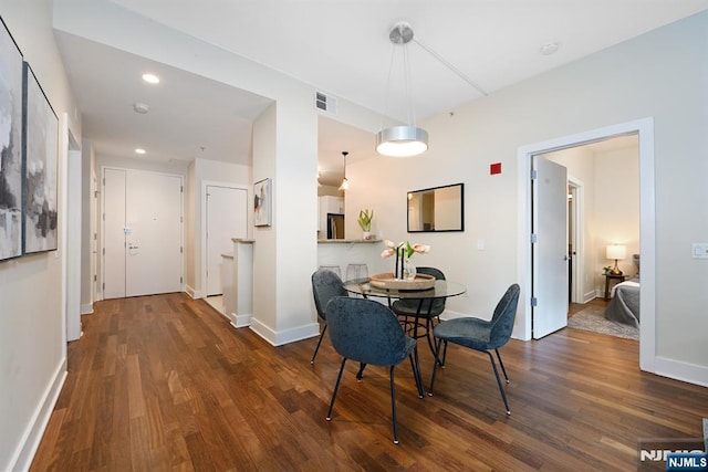 dining area featuring recessed lighting, wood finished floors, visible vents, and baseboards