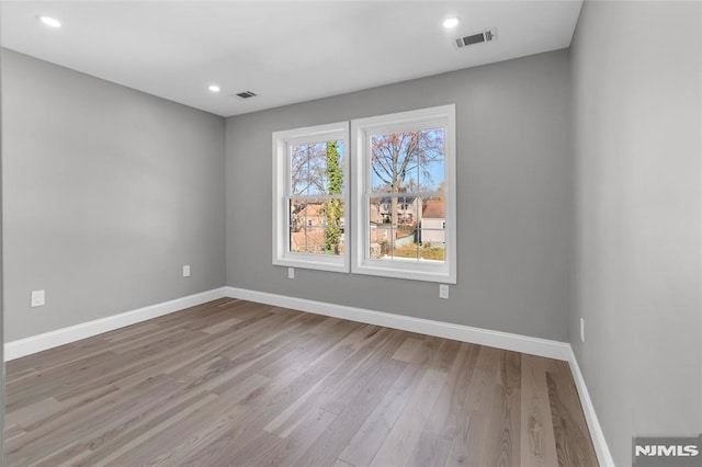 empty room with light wood-type flooring