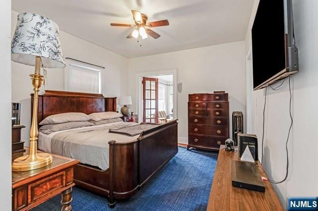 bedroom featuring dark wood-type flooring and ceiling fan