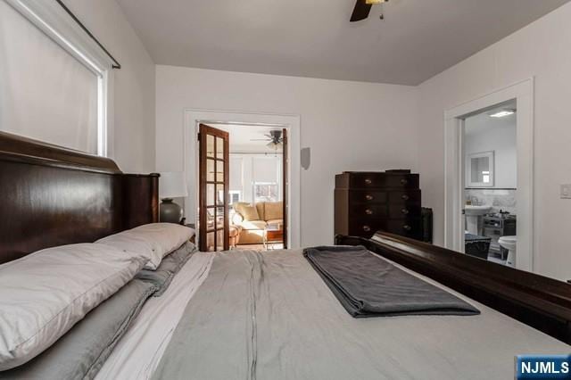 bedroom with connected bathroom and ceiling fan