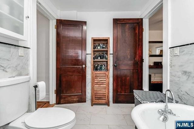 bathroom with a bathtub and toilet