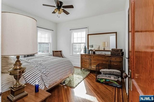 bedroom featuring hardwood / wood-style floors and ceiling fan